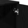 A close-up view of a black cabinet door with a metal hinge. Náhled obrázku produktu