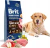 A bag of dog food is shown next to a golden retriever and some of the ingredients. Náhled obrázku produktu