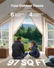 A couple and their dog are sitting on the floor inside a spacious tent, looking out at a scenic view of a lake and trees. Produktbild-Vorschau