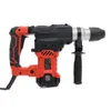 A red and black rotary hammer drill is shown against a white background. Náhled obrázku produktu
