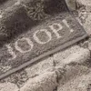 A close-up view of a textured gray towel with a subtle pattern and the brand name 'JOOP!' embossed on it. Produktbild-Vorschau
