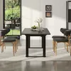 A dining room scene with a black table and chairs set up on a rug. Anteprima dell’immagine prodotto