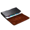 A black leather phone case with a brown interior, holding a smartphone. Produktbild-Vorschau
