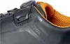 Close-up of a black shoe with orange lining, showing the brand logo. Anteprima dell’immagine prodotto