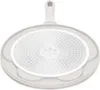 The underside of a frying pan is shown against a white background. Podgląd zdjęcia produktu