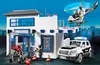 A Playmobil police station playset with a police car, helicopter, and figures. Produktbild-Vorschau