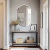 An entryway console table with a mirror above it, decorated with flowers and baskets. Podgląd zdjęcia produktu