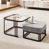 Two modern coffee tables are displayed on a striped rug in a living room setting. Voir les images du produit