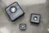Three square work lights of varying sizes are arranged on a gray concrete surface. Anteprima dell’immagine prodotto