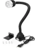 A machine lamp with a flexible neck and a base, along with mounting hardware and screws, displayed on a white background. Produktbild-Vorschau