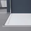 A close-up view of a shower tray and a toilet in the background. Produktbild-Vorschau