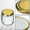 A collage of images showing a glass jar with a gold lid, close-ups of the lid, and the inside of the lid. Voir les images du produit