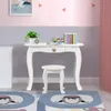 A child's white vanity desk and stool set in a room with pink and gray walls. Podgląd zdjęcia produktu