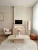 A cozy living room scene with a pouf as part of the decor. Produktbild-Vorschau