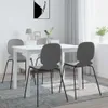 A dining room scene with a white table and four gray chairs. Produktbild-Vorschau