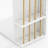 A close-up view of a white side table with wooden dowels. Náhľad obrázku produktu