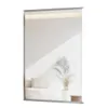 A modern, frameless rectangular mirror reflecting a minimalist interior scene with a sofa and a potted plant. Produktbild-Vorschau