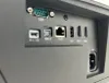 A close-up view of the rear connection panel of an electronic device, showing various ports. Produktbild-Vorschau