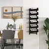 A dining area with a table, chairs, artwork, and a wine rack mounted on the wall. Podgląd zdjęcia produktu