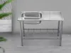 A stainless steel sink with a drying rack and a lower shelf, set against a plain gray background. Produktbild-Vorschau