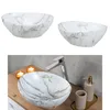 A collage of bathroom sinks and a bathroom scene with a sink, faucet, and accessories. Produktbild-Vorschau