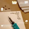 A flat lay of wood sheets, a wood burning tool, and accessories for crafting. Náhled obrázku produktu