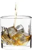 Whiskey being poured into a glass with ice cubes. Produktbild-Vorschau