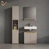 A modern bathroom vanity set with a mirror, sink, and storage cabinet against a textured gray wall. Produktbild-Vorschau