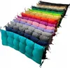 A collection of colorful cushions arranged diagonally on a white background. Produktbild-Vorschau