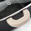 A close-up of a pot handle and lid edge. Náhled obrázku produktu