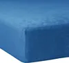 A close-up view of a blue fitted sheet.