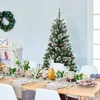 A Christmas tree and a decorated dining table set for a meal. Náhľad obrázku produktu