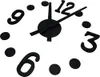 A close-up of a black wall clock with numbers and hands. Náhled obrázku produktu