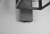 A close-up of a modern outdoor wall light fixture mounted on a white wall. Anteprima dell’immagine prodotto