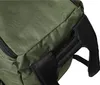 A close-up view of the handle and fabric of a green backpack. Náhled obrázku produktu
