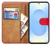 A book-style phone case with a phone inserted, showing cards and euro banknotes in the wallet section. Anteprima dell’immagine prodotto