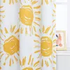 A close-up of a curtain with a yellow sun pattern on a white background. Produktbild-Vorschau