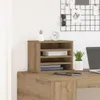A desk organizer with books, a plant, and a clock on top of a desk. Produktbild-Vorschau