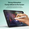 A hand is using a stylus on a tablet screen, with text overlay describing the product's features. Voir les images du produit