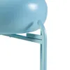 A close-up view of a light blue plant stand with a pot. Voir les images du produit
