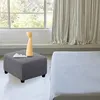 A modern living room scene with an ottoman and a vase. Produktbild-Vorschau