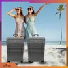 Two women on a beach with luggage. Náhled obrázku produktu
