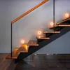 A modern staircase with wooden steps and integrated LED lights. Produktbild-Vorschau