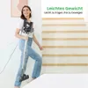 A woman is holding a vacuum cleaner while walking up a set of stairs. Podgląd zdjęcia produktu
