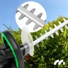 Close-up of a hedge trimmer's cutting blades and handle, with a magnified view of the blades. Náhľad obrázku produktu