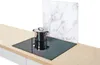 A glass stove top protector with a marble pattern is shown behind a pot on a stove. Anteprima dell’immagine prodotto