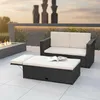 An outdoor patio setting with rattan furniture and a fire pit. Podgląd zdjęcia produktu