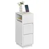 A white bedside table with a vase of flowers, books, and a smartphone on it. Náhled obrázku produktu