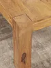 Detailaufnahme des Holzbeins und der Tischkante des Couchtisch Akazie Massivholz 60cm Landhausstil Braun Natur. Anteprima dell’immagine prodotto