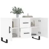 A white sideboard with black handles and legs, featuring open doors and drawers, decorated with a vase of flowers and books. Produktbild-Vorschau